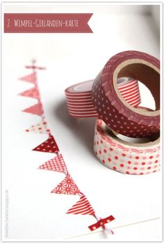 two red and white washi tapes sitting next to each other on top of a table