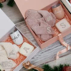 the baby's first christmas gift box is filled with personalized items, such as socks and blankets