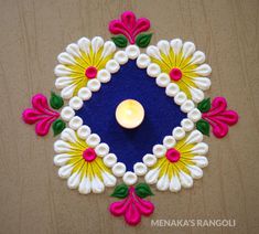 a candle is lit in the center of a decorated rangolite