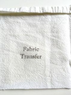 a white towel with the words fabric transferer printed on it