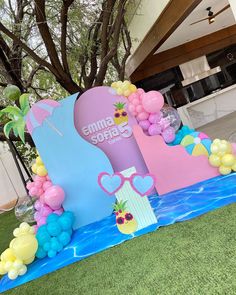 an outdoor area with balloons and decorations