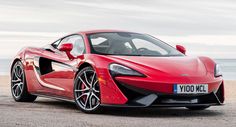 a red sports car parked on the beach