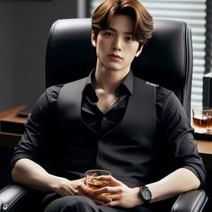 a man sitting in an office chair holding a glass of whiskey and looking at the camera