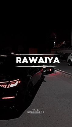 the back end of a car parked in a parking lot at night with the words rawaya on it