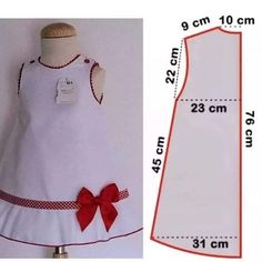 a dress with a red bow on the back and measurements for it to be sewn