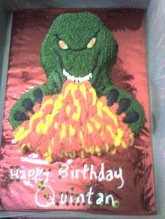 a birthday cake decorated with an image of a monster