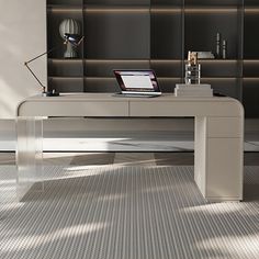 a laptop computer sitting on top of a desk in front of a book shelf and bookshelf