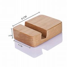 two square wooden coasters with measurements for each side and the top one showing it's size