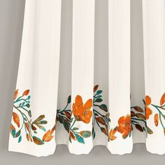 white curtains with orange and green flowers on them