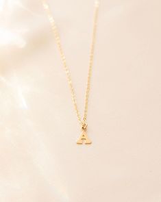 Letter necklace, Initial necklace, Gold initial necklace, Minimal initial necklace, Tiny initial necklace, Name necklace, Gold letter --- Stun in this personalized dainty gold filled mini Letter Necklace and you'll never want to take it off. Details: -Gold Filled, Sterling Silver -8mm Letter -Waterproof, Tarnish Resistant, Hypoallergenic -Length 18" Dainty Gold Initial Necklace, Letter Necklace Initials, Gold Initial Necklace, Name Necklace Gold, Necklace Name, Necklace Initial, Gold Letter, Initial Necklace Gold, Gold Initial