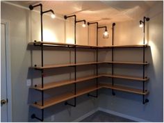 an empty room with shelves and lights in it