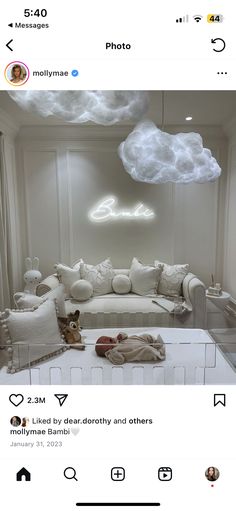 an instagramted photo of a living room with white furniture and clouds above the couch