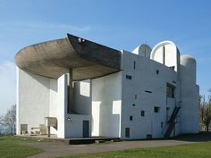 the building is white and has a curved roof