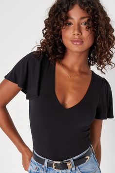 Everyone will be intrigued by the flirty essence that you and the Lulus Have You Crushin' Black Flutter Sleeve Bodysuit bring everywhere you go! Stretchy and soft jersey knit shapes this essential top that features a V-neckline and flirty, fluttery short sleeves. The figure-flaunting silhouette continues down to attached thong bottoms that secure with snap closures. Fit: This garment fits true to size. Length: Size medium measures 27" from shoulder to hem. Bust: Great for any cup size. Waist: Fi Wineries Outfit, Spring Break Outfit, Body Suit With Shorts, Lulu Fashion, V Neck Bodysuit, Knit Bodysuit, Bralette Tops, Flutter Sleeve Top, Black Bodysuit