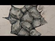 a drawing of rocks on a white wall