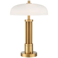 a gold lamp with a white shade on it