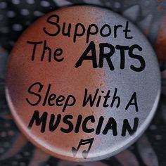 a button with words on it that says support the arts sleep with a musician in black