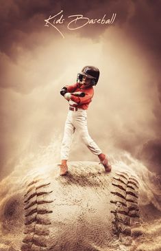 a young baseball player holding a bat on top of a sand mound with clouds in the background