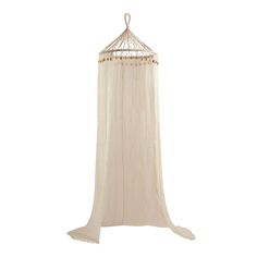 a white canopy with beads hanging from it