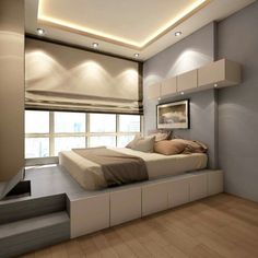 a bed sitting on top of a wooden floor in a bedroom next to a window