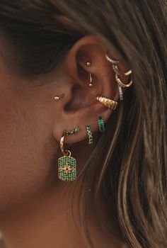 The Emerald Huggie – Jay Nicole Designs Conch Piercing Thick Hoop, Jewel Color Outfits, Colorful Ear Stack, Four Piercings Ears, Chunky Earring Stack, Ear Piercing Designs, Ear Piercings Unique, Ear Piercing Styling, Styled Ear Piercings