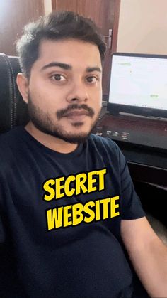 a man sitting in front of a computer monitor with the words secret website on it