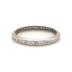 A secure and shimmering wedding band for everyday wear. This Art Deco eternity band features .48 carats of single cut diamonds in platinum. Forty-eight (48) glittering diamonds are securely set in a channel around the entire band. An antique ring with modern sensibility, this wedding band is perfect to pair with any era of engagement ring. Finished in high polished platinum, this wedding band has a sleek design that looks lovely on everyone. PRIMARY STONE Stone: Genuine Natural Diamond Measureme Mens Wedding Bands Platinum, Platinum Diamond Wedding Band, Modern Wedding Band, Antique Wedding Bands, Marquise Diamond Engagement Ring, Diamond Eternity Band, Antique Wedding, Antique Ring, Eternity Ring Diamond