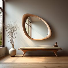 a room with a bench, mirror and vase on the floor in front of it