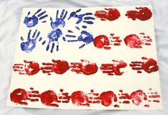 a piece of paper with red, white and blue handprints on it