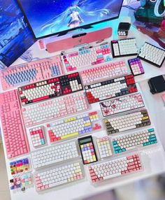 there are many keyboards and mouses on the table next to each other, all in different colors