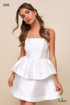 You'll be the life of the party wherever you go in the Lulus Bubbly Charm White Taffeta Tiered Ruffled Mini Dress! Structured woven taffeta shapes this charismatic dress that will always have you the center of attention. Adjustable spaghetti straps support a darted bodice with a straight neckline. Fitted waist sits above a tiered skirt with voluminous ruffles that finishes at a mini hem. Hidden zipper/clasp at back. Fit: This garment fits true to size. Length: Mid-thigh. Size medium Bust: Great for any cup size. Waist: Fitted - very fitted at natural waist. Hip: Not Fitted - fuller skirt allows room for hips. Undergarments: May be worn with a strapless bra, adhesive bra, petals, or no bra. Fabric: Fabric has no stretch. Lined. Shell: 100% Polyester. Lining: 95% Polyester, 5% Spandex. Hand Ruffled Mini Dress, Lulu Fashion, Adhesive Bra, Straight Neckline, Life Of The Party, Strapless Bra, Cup Size, Tiered Skirt, Dress 100