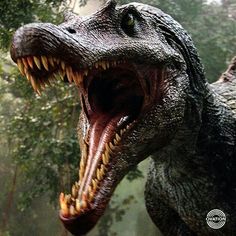 a large dinosaur with its mouth open in the forest