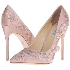 a pair of women's pink high heels with sequins on the toes