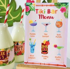 the tiki bar menu is next to some drinks