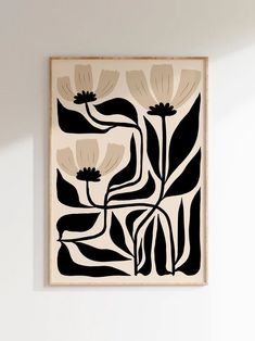 a black and white painting hanging on the wall