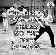 two people doing karate in a gym with the words work until your mind forgets and your body remembers