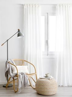 a chair and table in front of a window