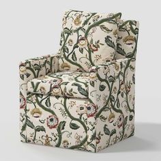 an upholstered chair with floral designs on it