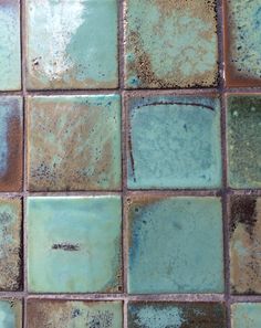 blue and brown tiles with rust on them