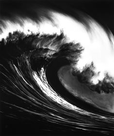an ocean wave is shown in black and white