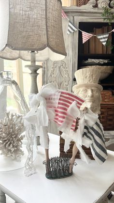 a white table topped with lots of different types of decorations