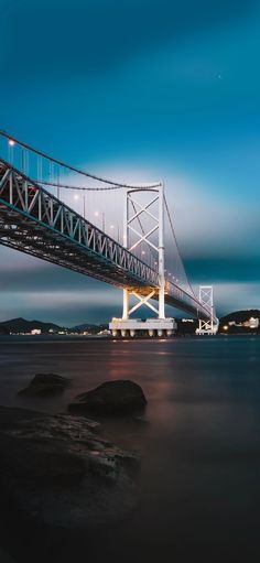 the bay bridge is lit up at night