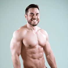 a shirtless man with no shirt on posing for the camera and smiling at the camera