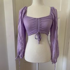 Purple Princess - Y Crop Top! This Piece Has So Much Potential And Versatility! Would Look Great Casually With Jeans, Or A Corset For A More Princess-Y Or Cottagecore Vibe, Could Also Layer Well With A Fairycore Look - And So Much More! Options Galore! Has Minor Signs Of Wear! No Flaws, But Doesn’t Look Brand New Either. #Coquette #Fairy #Fairycore #Princesscore #Cottagecore Rapunzel Disney Tangled Ruched Blouse Rapunzel Outfit Ideas, Rapunzel Stuff, Rapunzel Outfit, Coquette Fairy, Princesscore Cottagecore, Rapunzel Disney, Ruched Blouse, Purple Princess, Purple Crop Top