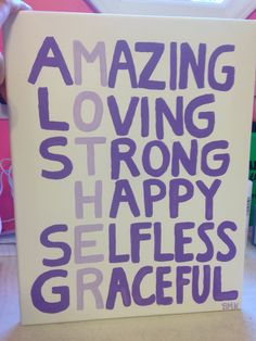 a sign that says amazing loving strong happy selfies gracefully on the side of a table