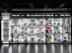 the nike innovation time line is displayed in an empty room with black and white walls