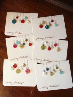 four christmas cards with buttons on them and the words diy christmas cards attached to them