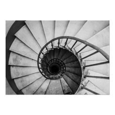 a black and white photo of a spiral staircase