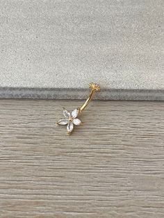 This cute flower belly button ring is made with surgical steel. A unique design, this marquise flower belly ring is a great minimalist/delicate option, very feminine and floral. Drop jaws with this body jewelry. This piece is internally threaded *Also available in silver and rose gold options. These pieces are 316L surgical steel but not 14k gold plated* **PACKAGE INSURANCE: Please either upgrade to priority express shipping at checkout if you would like to insure your package OR you can also purchase insurance separately Insurance up to $100 for $1.50 here: https://www.etsy.com/listing/1296961518 Insurance up to $200 for $2.00 here: https://www.etsy.com/listing/1310991679 Details & Size: ♥ 316L Surgical Steel ♥ Internally threaded ♥ Size: 10mm bar, 14G ♥ Every purchase comes with an Elara 14g Belly Button Ring, Pretty Belly Button Piercings Gold, Navel Jewelry Unique, Unique Belly Rings Gold, Minimalistic Belly Button Piercing, Delicate Belly Button Piercing, Crystal Belly Button Ring, Belly Button Piercing Aesthetic Simple, Dainty Belly Ring