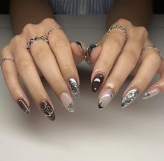 a woman's hands with manies and rings on them